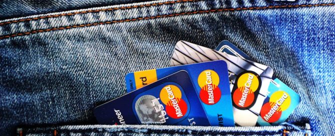 multiple MasterCards in the back pocket of a pair of jeans. chargeback protection for credit repair companies helps to keep them afloat by not being buried in legalities.