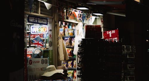 an illuminated tobacco and vape shop kiosk. merchant services in the vaping industry have expanded due to the 2018 farm bill.